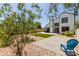 A private backyard featuring a paved patio, grass lawn, and lush landscaping at 830 E Gila Ln, Chandler, AZ 85225