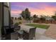 Relaxing backyard with outdoor seating, a grassy area, and desert landscaping at 830 E Gila Ln, Chandler, AZ 85225
