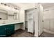 A renovated bathroom with a vanity, walk-in shower, and modern fixtures at 830 E Gila Ln, Chandler, AZ 85225