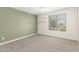 Bright bedroom features a ceiling fan, floating shelves, and a large window at 830 E Gila Ln, Chandler, AZ 85225