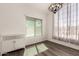 Bright dining room featuring modern lighting, window views, and wood floors at 830 E Gila Ln, Chandler, AZ 85225