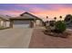 Charming single-story home with a two-car garage and well-manicured desert landscaping at 830 E Gila Ln, Chandler, AZ 85225