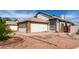 Charming home featuring a two-car garage, landscaped yard, and neutral exterior at 830 E Gila Ln, Chandler, AZ 85225