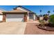 Charming home featuring a two-car garage, landscaped yard, and neutral exterior at 830 E Gila Ln, Chandler, AZ 85225