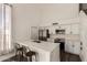 Bright, modern kitchen featuring white cabinets, stainless appliances, and a breakfast bar at 830 E Gila Ln, Chandler, AZ 85225