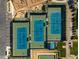 Aerial view of multiple outdoor tennis courts with lush green landscaping at 841 E Farmers Ln, Queen Creek, AZ 85140