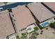 Aerial view of the backyard patio, swimming pool, desert landscaping, and tile roof at 841 E Farmers Ln, Queen Creek, AZ 85140