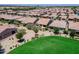 Aerial view of residential neighborhood and green common space at 841 E Farmers Ln, Queen Creek, AZ 85140