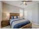 Comfortable bedroom features a wooden bed, side tables with lamps, and closet doors at 841 E Farmers Ln, Queen Creek, AZ 85140