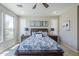 Bright bedroom features neutral walls, stylish furniture, and plantation shutters, enhancing the room's appeal at 841 E Farmers Ln, Queen Creek, AZ 85140