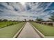 A lovely bocce ball court with well-manicured turf and vibrant landscaping against a scenic backdrop at 841 E Farmers Ln, Queen Creek, AZ 85140