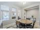 Chic dining area features a round table, seating for four, and views of the living spaces at 841 E Farmers Ln, Queen Creek, AZ 85140