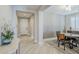 Inviting entryway with light wood-look tile flooring and views of the front door and dining area at 841 E Farmers Ln, Queen Creek, AZ 85140
