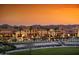 Upscale neighborhood with well manicured lawns and luxurious homes at dusk at 841 E Farmers Ln, Queen Creek, AZ 85140