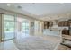 Comfortable living room with access to the patio and a view into the modern kitchen at 841 E Farmers Ln, Queen Creek, AZ 85140
