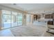 Open-concept space connects the living room to the modern kitchen, with large sliding doors to the patio at 841 E Farmers Ln, Queen Creek, AZ 85140