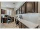 Well-lit home office with built-in desks, ample storage, and modern decor at 841 E Farmers Ln, Queen Creek, AZ 85140
