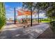 Community playground with shade coverings and various play structures at 841 E Farmers Ln, Queen Creek, AZ 85140