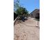 Spacious backyard with gravel landscaping and a charming circular paver patio for outdoor enjoyment at 8419 S 40Th Dr, Laveen, AZ 85339