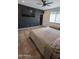 Bedroom features a large bed, TV, and a storage chest at the end of the bed at 8419 S 40Th Dr, Laveen, AZ 85339