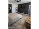 Bedroom features a large bed, TV, and a storage chest at the end of the bed at 8419 S 40Th Dr, Laveen, AZ 85339
