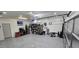 Well-organized garage with epoxy flooring, shelving units, TV, and ample storage space at 8419 S 40Th Dr, Laveen, AZ 85339