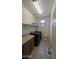 A practical laundry room featuring a countertop, modern appliances, and storage shelves at 8419 S 40Th Dr, Laveen, AZ 85339