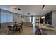 An open floor plan with neutral walls, tile flooring, plenty of lighting, and comfortable seating at 8419 S 40Th Dr, Laveen, AZ 85339