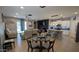 Spacious open floor plan featuring modern furniture, a large dining table, and an island with barstool seating at 8419 S 40Th Dr, Laveen, AZ 85339