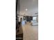 Bright living room flows into dining area with tile floors, a modern kitchen, and a comfortable seating area at 8419 S 40Th Dr, Laveen, AZ 85339