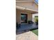 Covered patio area with comfortable seating and a sliding glass door leading to the indoors at 8419 S 40Th Dr, Laveen, AZ 85339