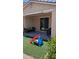 The covered patio features comfortable seating and access to a backyard with a playground slide at 8419 S 40Th Dr, Laveen, AZ 85339