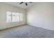 Spacious bedroom featuring carpet and a window with bright natural light at 8438 W Bajada Rd, Peoria, AZ 85383