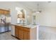 Bright, open kitchen featuring stainless steel appliances and a kitchen island at 8438 W Bajada Rd, Peoria, AZ 85383