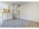 A spacious and modern living room showcasing an open floor plan and staircase at 8438 W Bajada Rd, Peoria, AZ 85383
