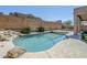 Swimming pool with desert landscaping and bright blue sky at 8438 W Bajada Rd, Peoria, AZ 85383