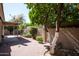 Inviting backyard featuring a brick patio and well-maintained greenery, with a covered patio to relax and enjoy outdoors at 8896 E Mescal St, Scottsdale, AZ 85260