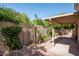 Serene backyard with mature landscaping and a covered patio offers a tranquil outdoor living space at 8896 E Mescal St, Scottsdale, AZ 85260