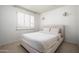 Cozy bedroom with a neutral color palette, carpet, and shutters at 8896 E Mescal St, Scottsdale, AZ 85260