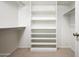 Walk-in closet featuring custom shelving and ample storage space at 8896 E Mescal St, Scottsdale, AZ 85260