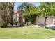 Charming home with well-maintained lawn, desert landscaping, and a welcoming entrance at 8896 E Mescal St, Scottsdale, AZ 85260