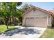 Single Gathering home featuring a two car garage and mature landscaping at 8896 E Mescal St, Scottsdale, AZ 85260