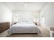Bright bedroom with neutral walls, carpet, ceiling fan, and plantation shutters at 8896 E Mescal St, Scottsdale, AZ 85260