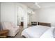 Spacious main bedroom featuring an ensuite bath, and a tranquil seating area and crib at 8896 E Mescal St, Scottsdale, AZ 85260