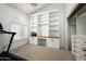 Bright home office with custom built-ins, a window, and carpet at 8896 E Mescal St, Scottsdale, AZ 85260