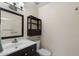 Compact bathroom with a vanity, toilet, and shower with a sliding glass door at 932 Leisure World --, Mesa, AZ 85206
