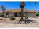 Charming single-story home featuring desert landscaping, mature palm trees, and a private two-car garage in a quiet neighborhood at 932 Leisure World --, Mesa, AZ 85206