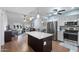Open-concept living space with bright kitchen, dining area, and a cozy living room with a ceiling fan and modern decor at 932 Leisure World --, Mesa, AZ 85206