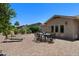 Outdoor patio features a brick surface, lounge chairs, and outdoor dining, perfect for entertaining at 932 Leisure World --, Mesa, AZ 85206
