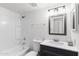 Bright bathroom features a shower-tub combo and stylish vanity, offering comfort and functionality at 948 S Alma School Rd # 97, Mesa, AZ 85210